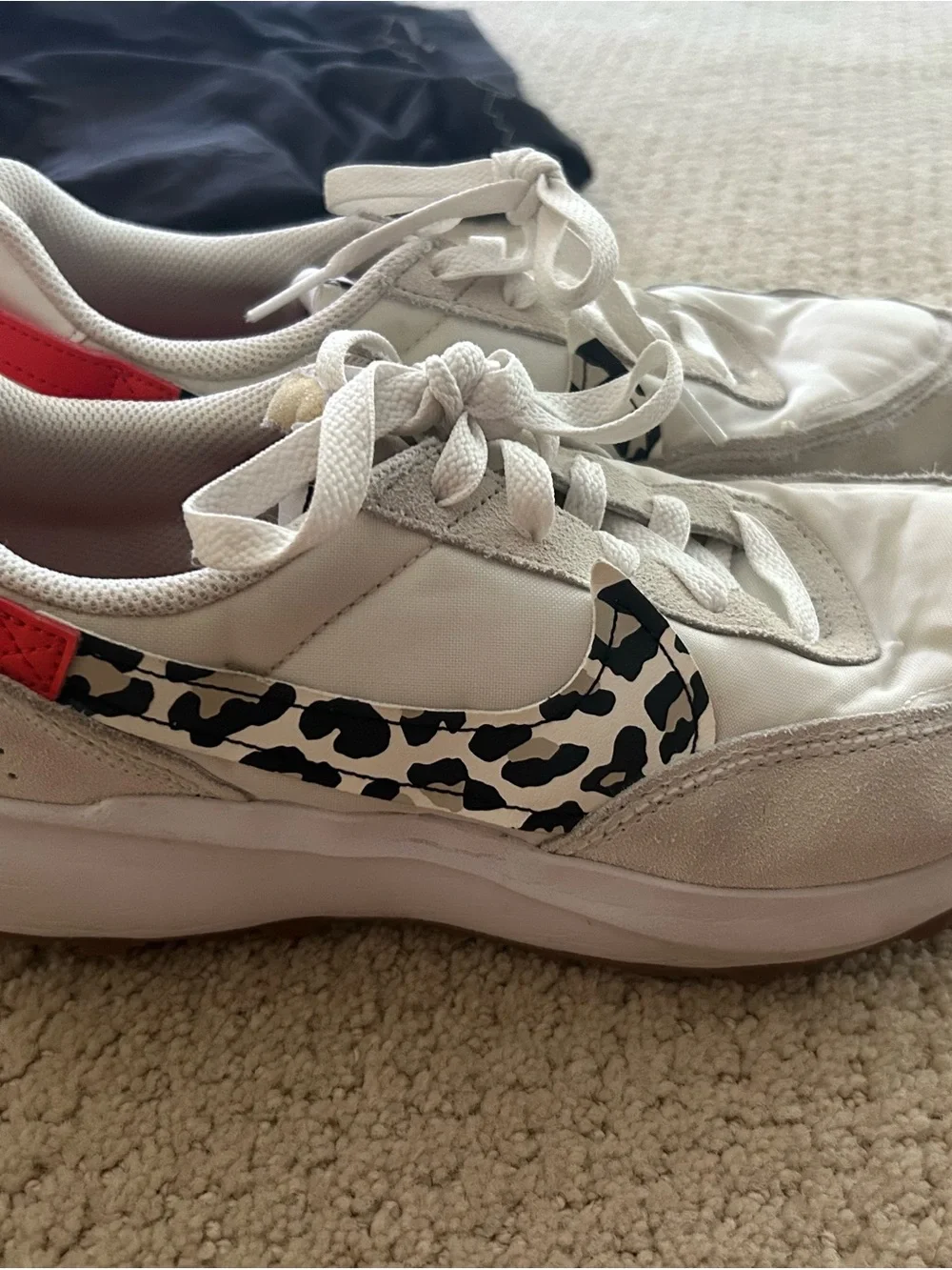 Nike Women’s White Sneakers with Coral Accents